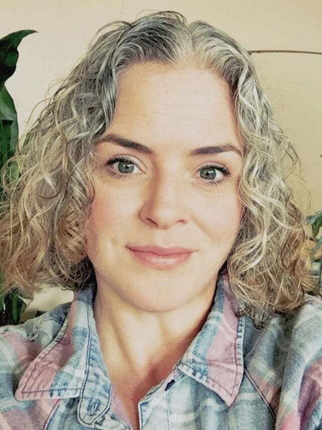 image of woman gray curly hair red ends
