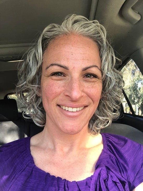 image of woman gray curly hair bob