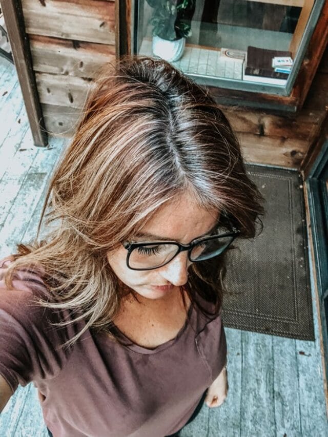 image of woman with red hair gray roots