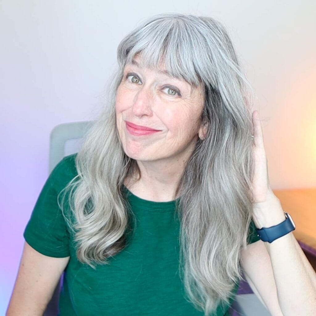 image of katie in dark green shirt