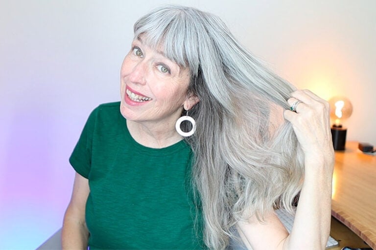 Katie showing off her healthy silver hair after following a gray hair care routine