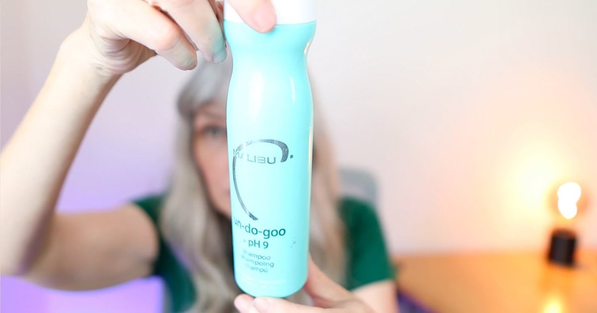 image of Katie holding up a bottle of Malibu C Undo Goo