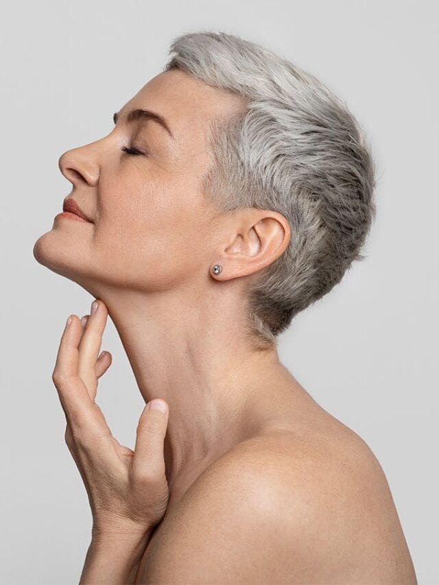 image of a woman with gray hair and makeup