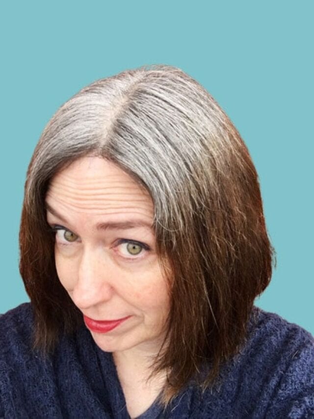 image of woman with white roots and fading dyed brown ends