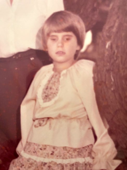 image of the author as a young child with a short haircut