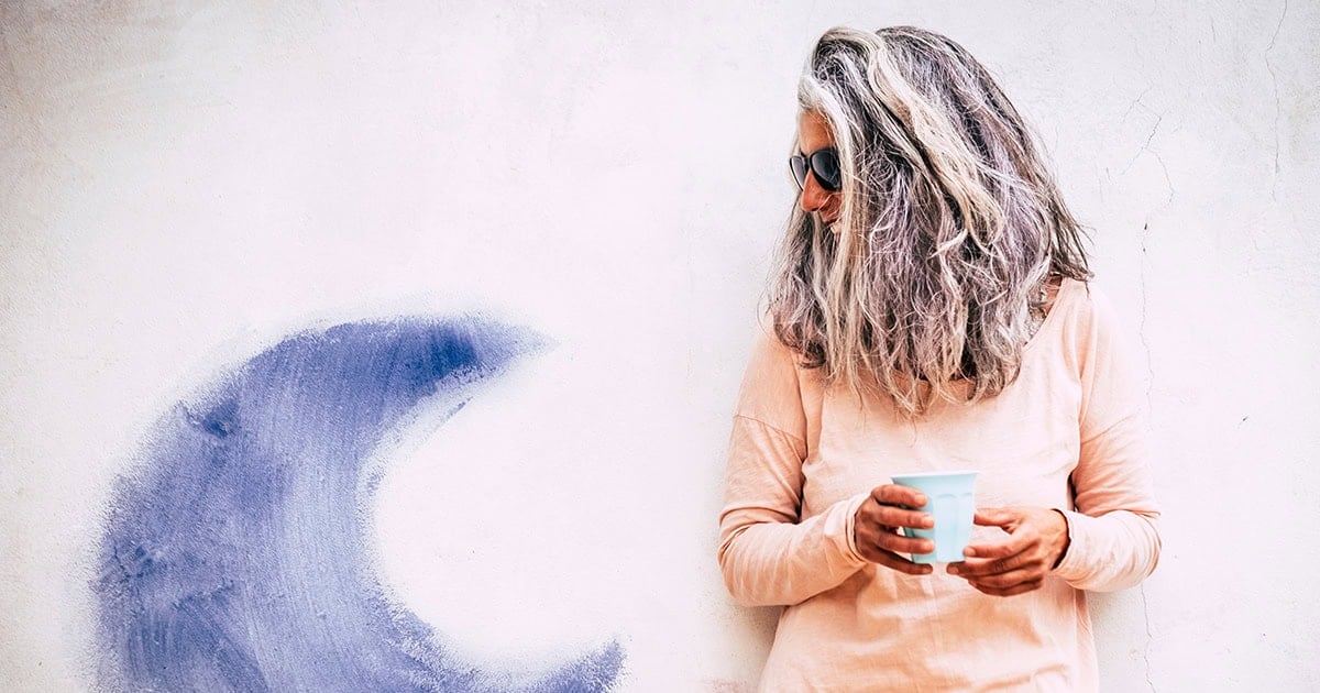 woman with messy wavy gray hair