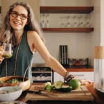 image of vibrant mature woman gray hair eating healthy food