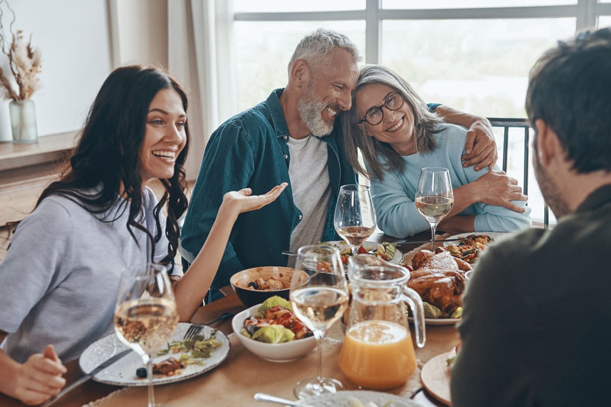 image of happy family eating dinner