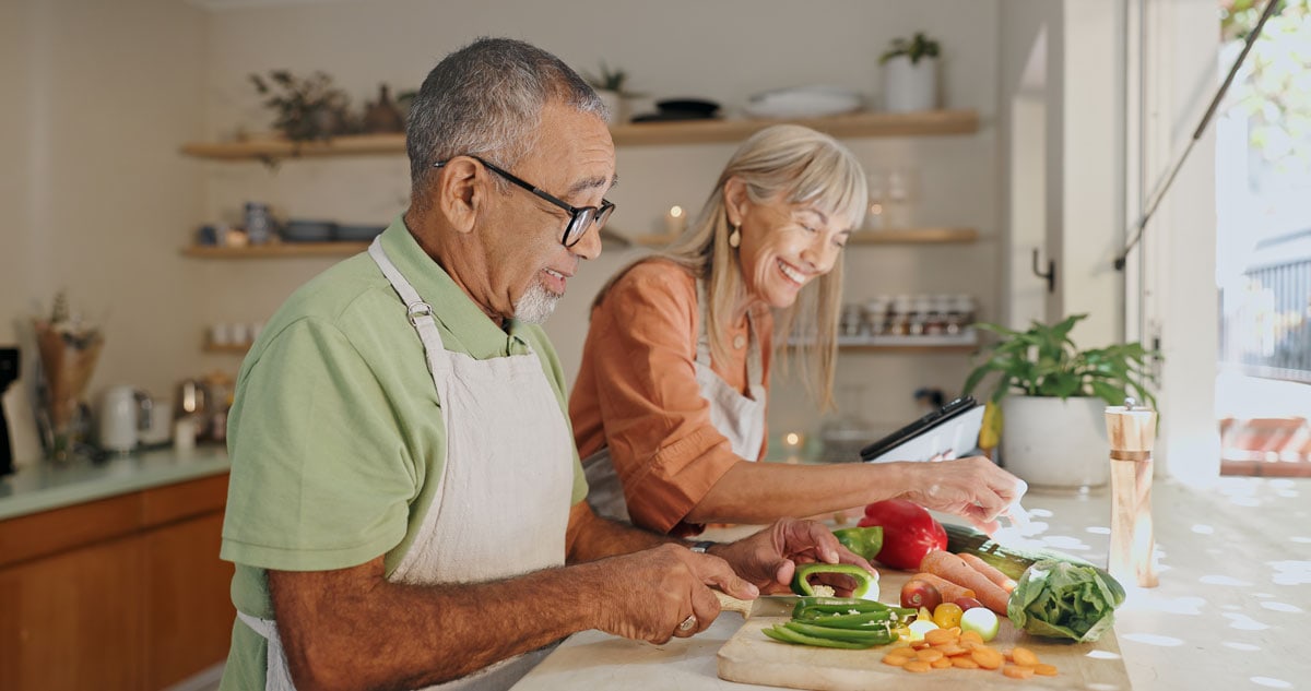 image of couple prepping healthy meals together