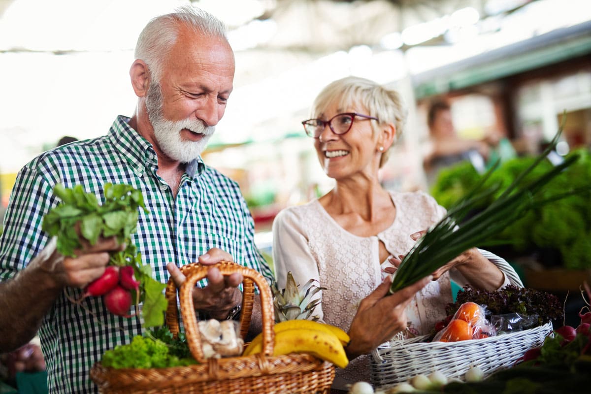 image of gray-haired couple at farmers market