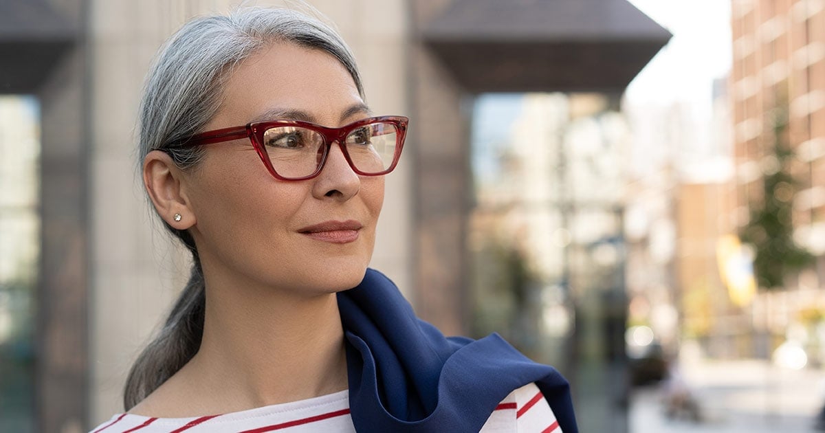 image of confident gray hair woman on city street