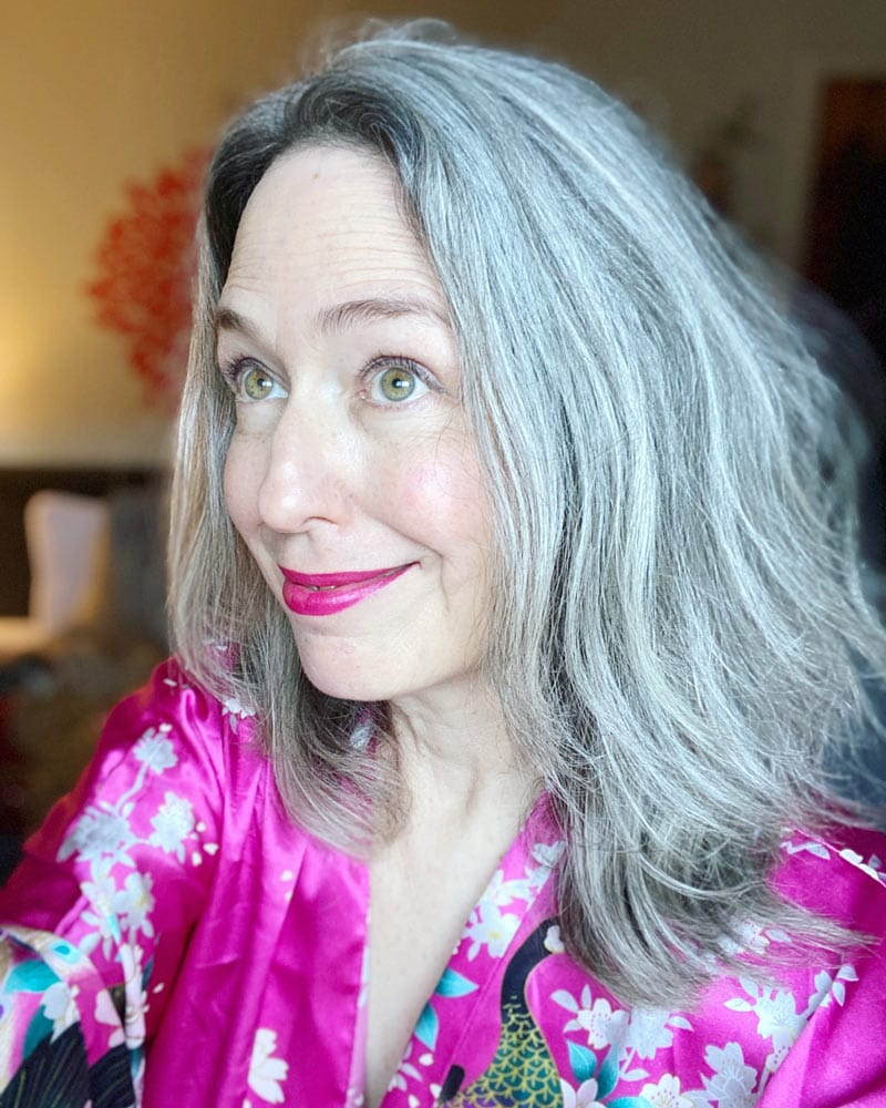 image of a woman with long gray hair and a pink kimono