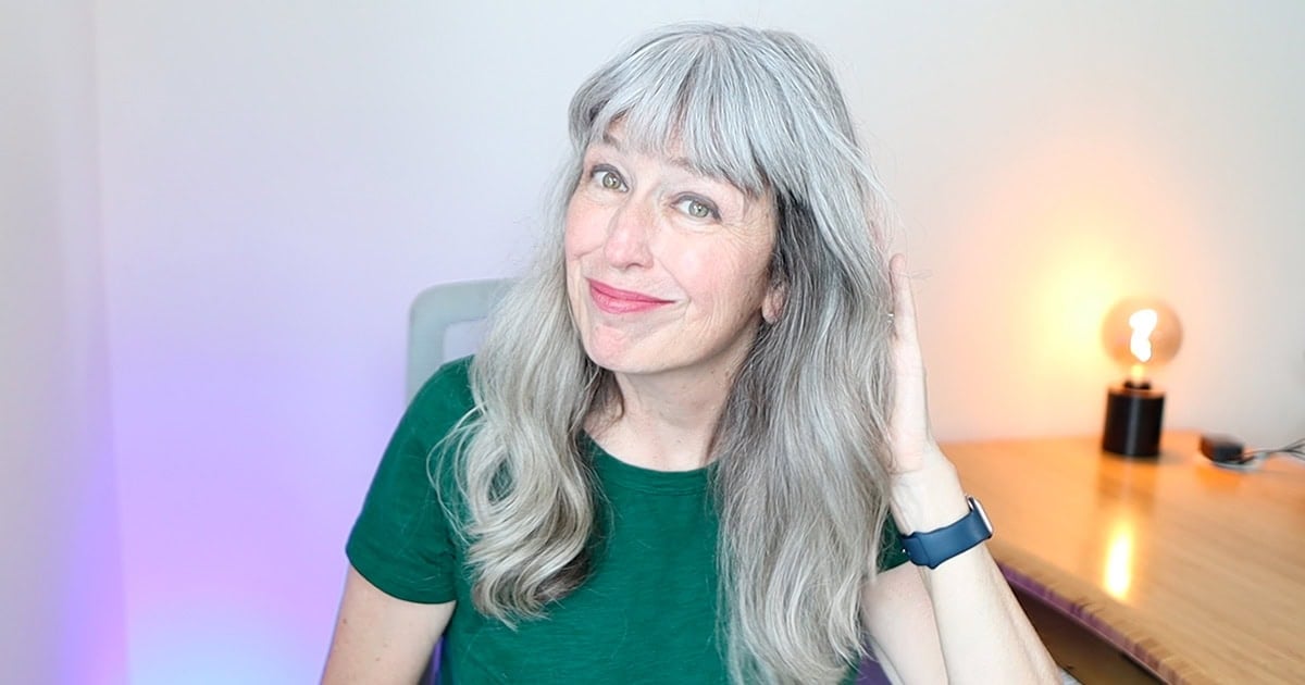 image of katie showing off her healthy gray hair