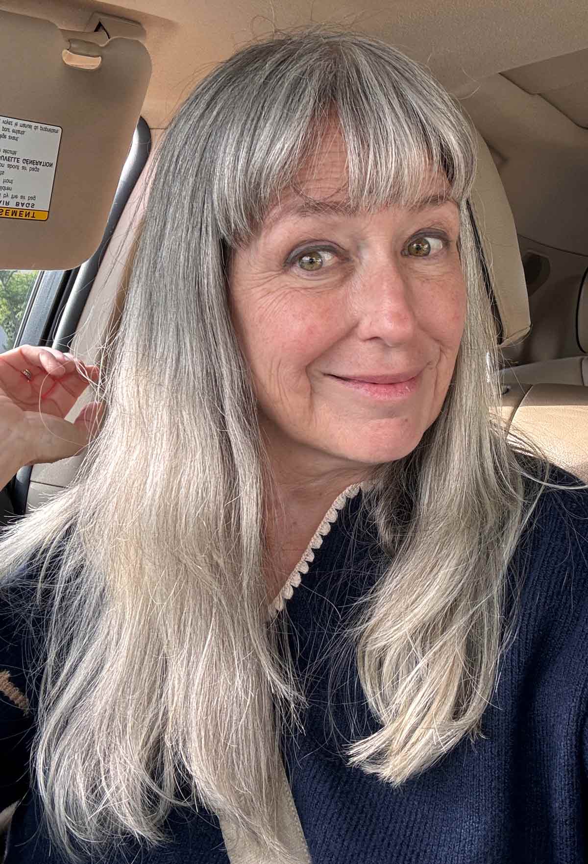 image of katie in car with curled under bangs